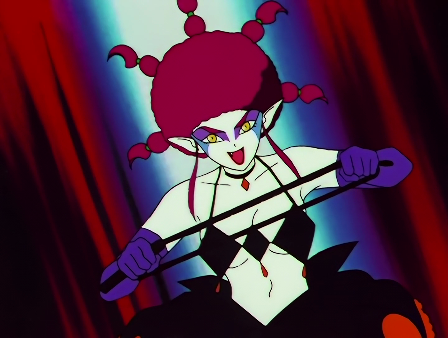 Kyokubadanko, a Lemures from Sailor Moon episode 129. She has pale white skin with purple eye shadow, and a red afro with five braids coming off it. Her outfit consists of a black top made of diamond shapes, a black poofy dress, and purple gloves. There’s nothing really monstrous about her design, but she has the whip. Oh boy, does she have the whip.